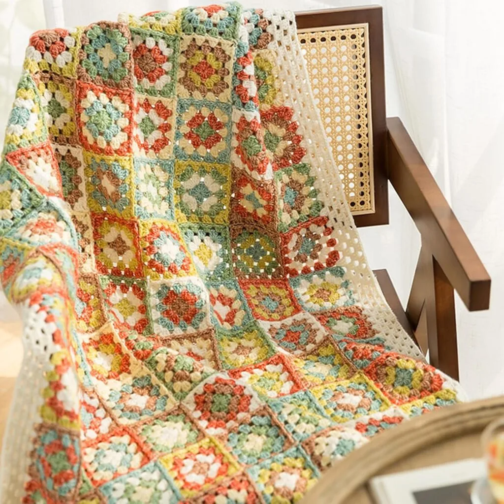 kits crochet plaid en granny squaresKit crochet couverture Granny Square avec pelotes et accessoires inclus.
Gros plan sur la couverture Granny Square crochet&eacute;e avec des couleurs harmonieuses.
Main tenant un crochet et assemblant des carr&eacute;s granny color&eacute;s.
Kit complet d&eacute;ball&eacute; : pelotes, crochet, ciseaux, aiguille, marqueurs et instructions d&eacute;taill&eacute;es.
Zoom sur les motifs granny crochet&eacute;s avec pr&eacute;cision.
Couverture termin&eacute;e, &eacute;l&eacute;gamment pos&eacute;e sur un canap&eacute; ou un lit.
D&eacute;tail des mailles et textures du fil coton-acrylique.
Kit crochet emball&eacute;, pr&ecirc;t &agrave; &ecirc;tre offert en cadeau.
D&eacute;butant r&eacute;alisant un carr&eacute; granny avec le tutoriel en arri&egrave;re-plan.
Vue d&rsquo;ensemble du kit et de la couverture Granny Square en cours de fabrication.